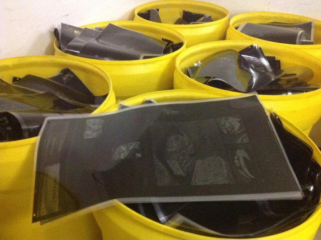 Yellow drums filled with used X-ray film